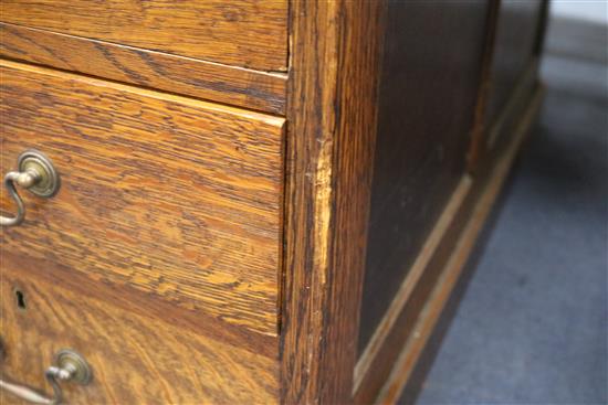 An Edwardian oak pedestal desk W.153cm